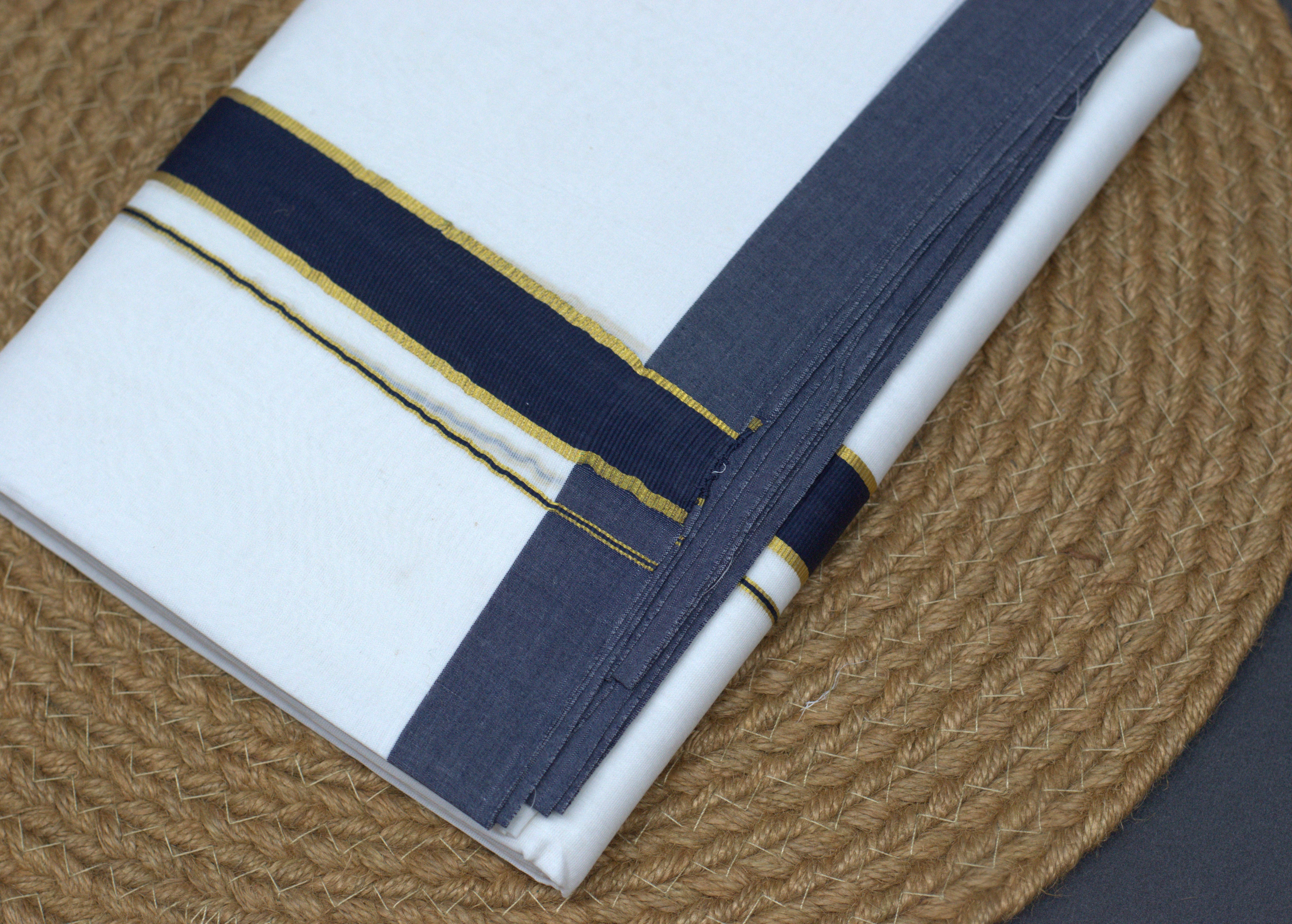 Traditional solid white body with a dual-tone Navy and Gold border