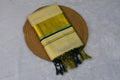 Cream & Gold Kasavu Saree Set with Green Border and Tassels - Main Product Image - Nushio