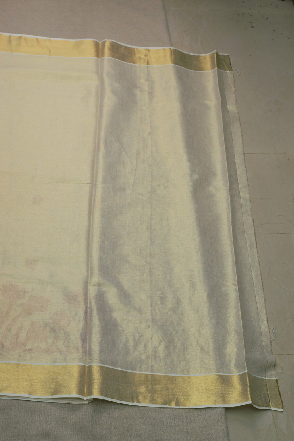 Kerala Tissue Saree with Maroon Floral Embroidery & Golden Kasavu Border