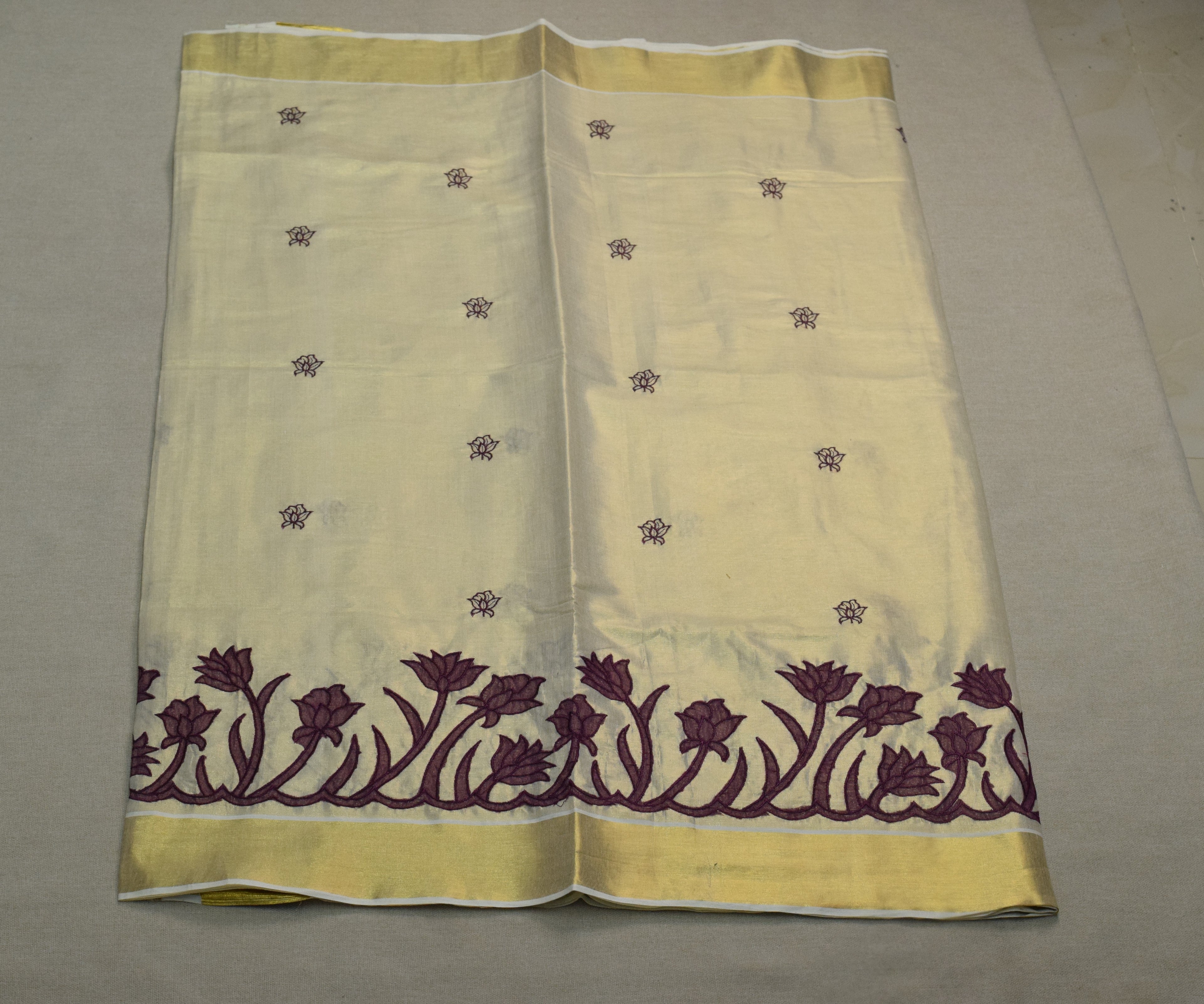 Kerala Tissue Saree with Lotus Embroidery Border &a Matching Blouse Piece