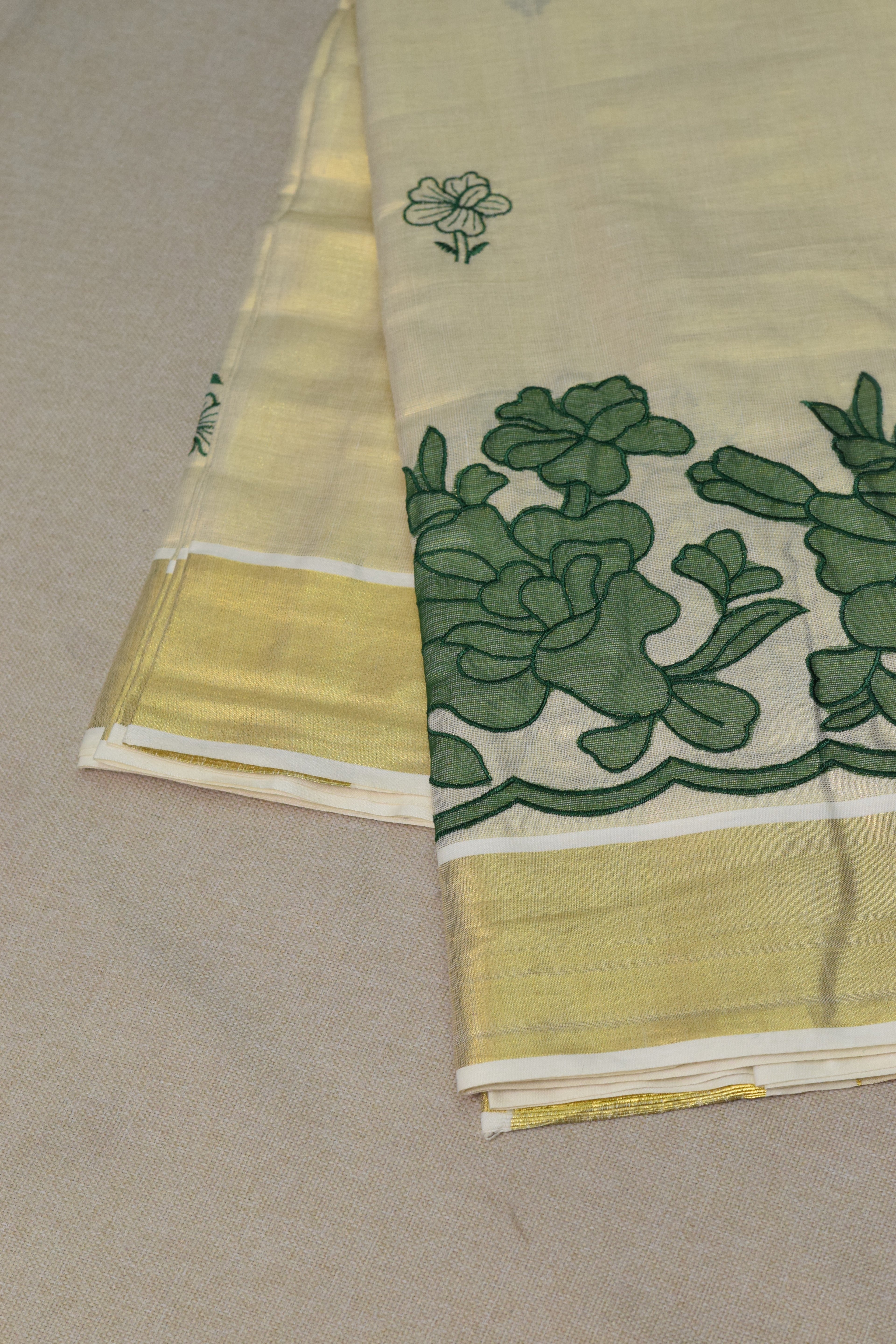 Kerala Tissue Saree with Green Floral Border & Traditional Golden Kasavu