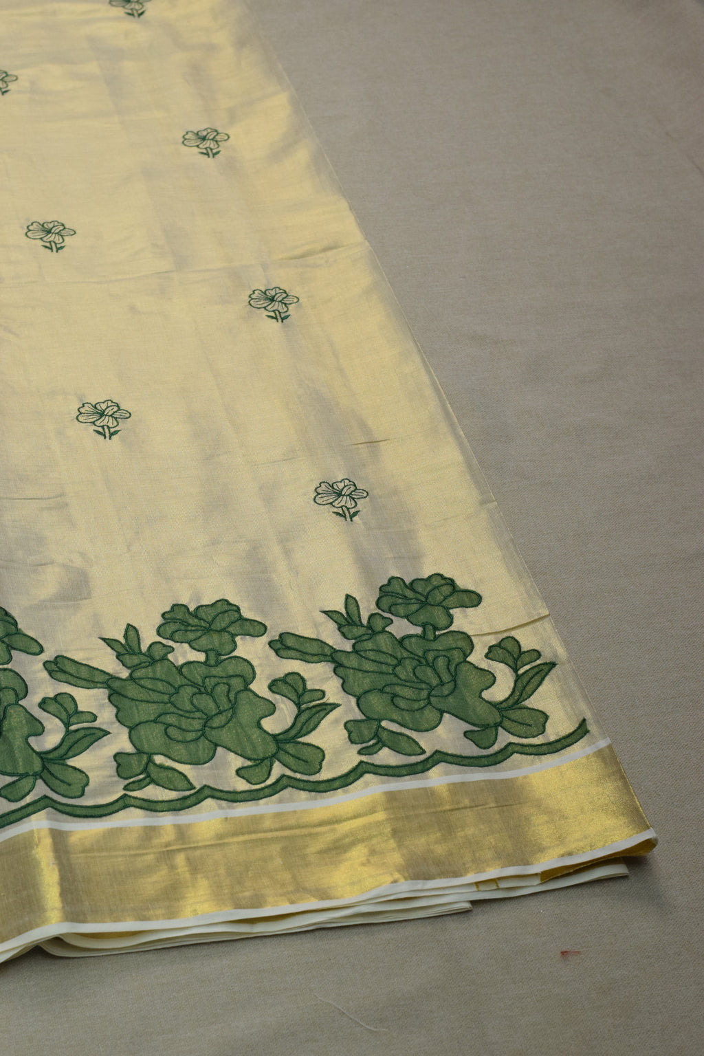 Kerala Tissue Saree with Green Floral Border & Traditional Golden Kasavu