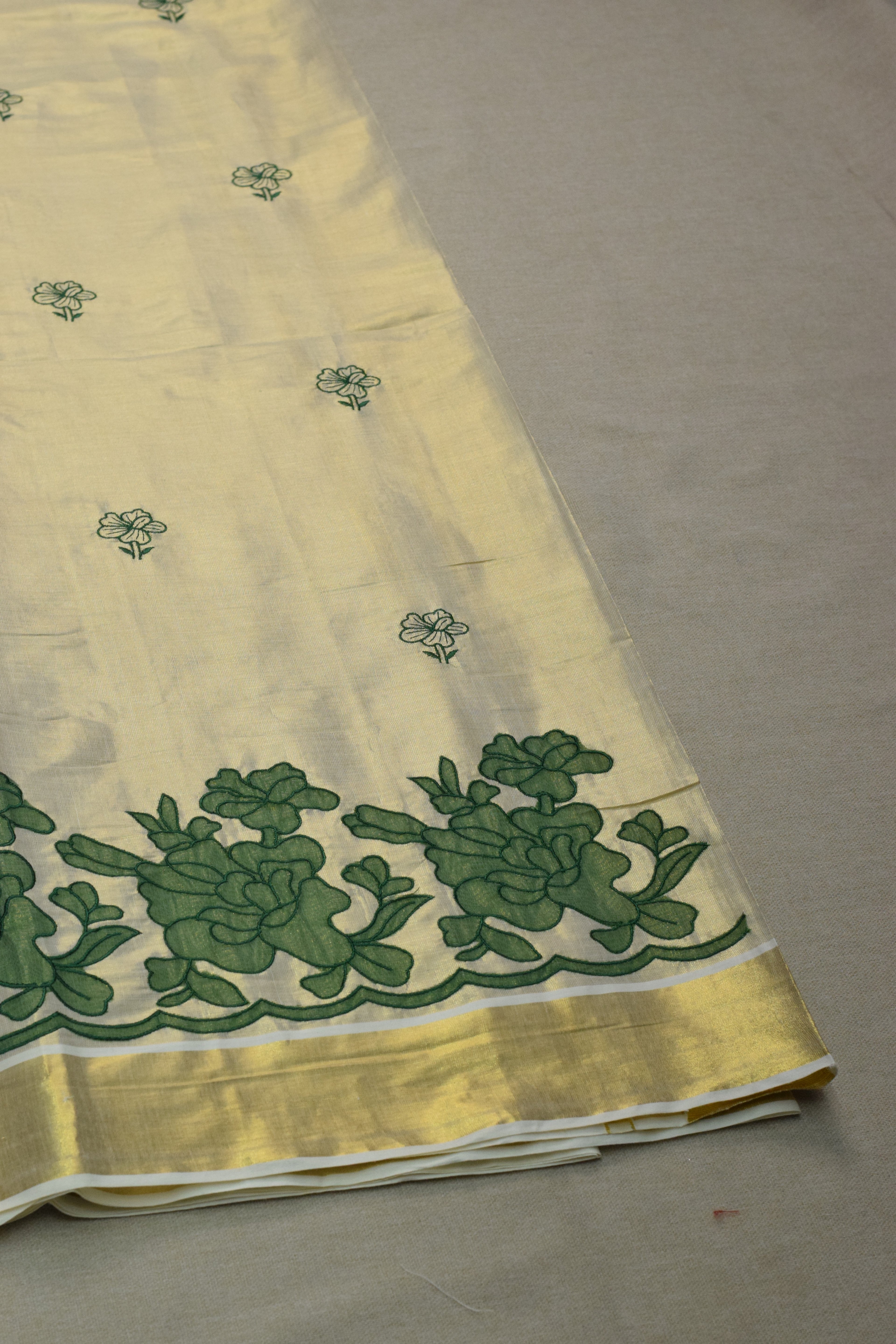 Kerala Tissue Saree with Green Floral Border & Traditional Golden Kasavu