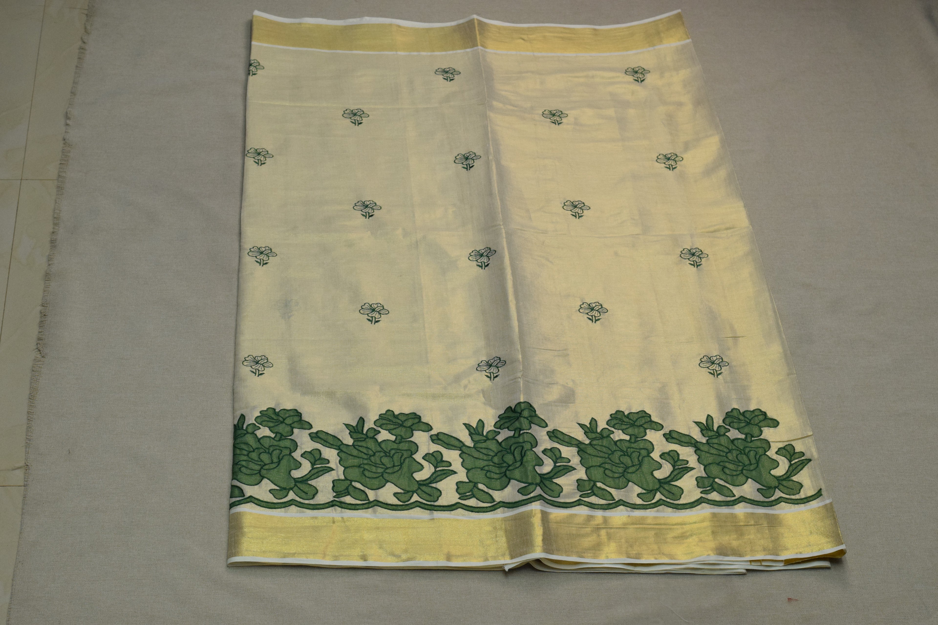 Kerala Tissue Saree with Green Floral Border & Traditional Golden Kasavu