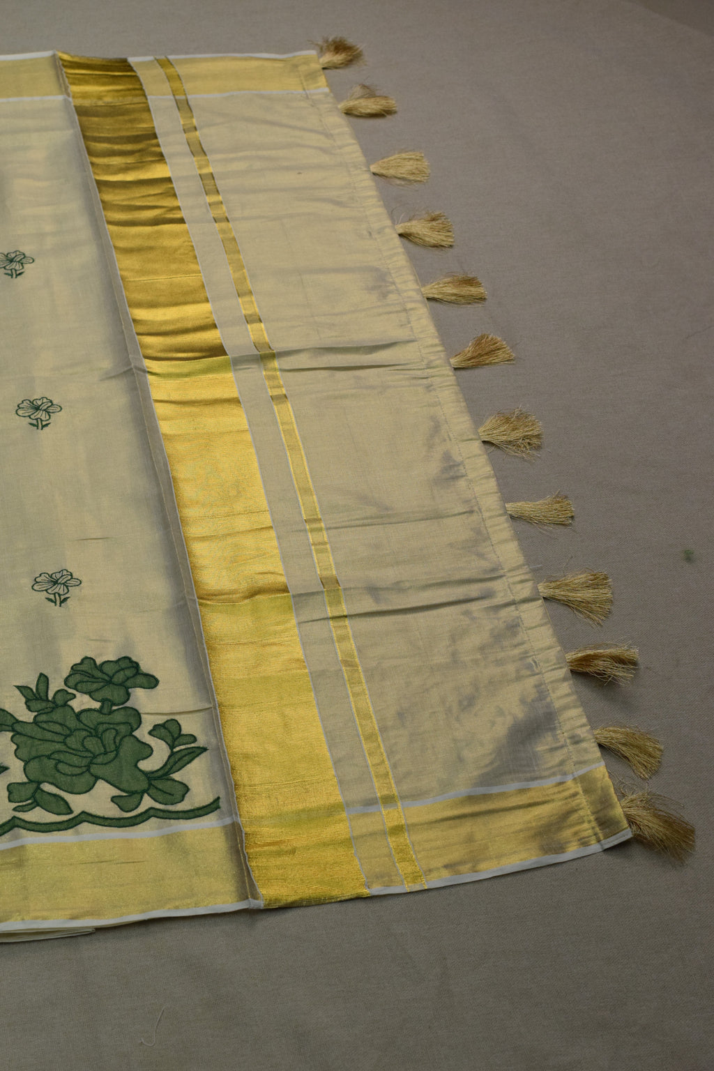 Kerala Tissue Saree with Green Floral Border & Traditional Golden Kasavu