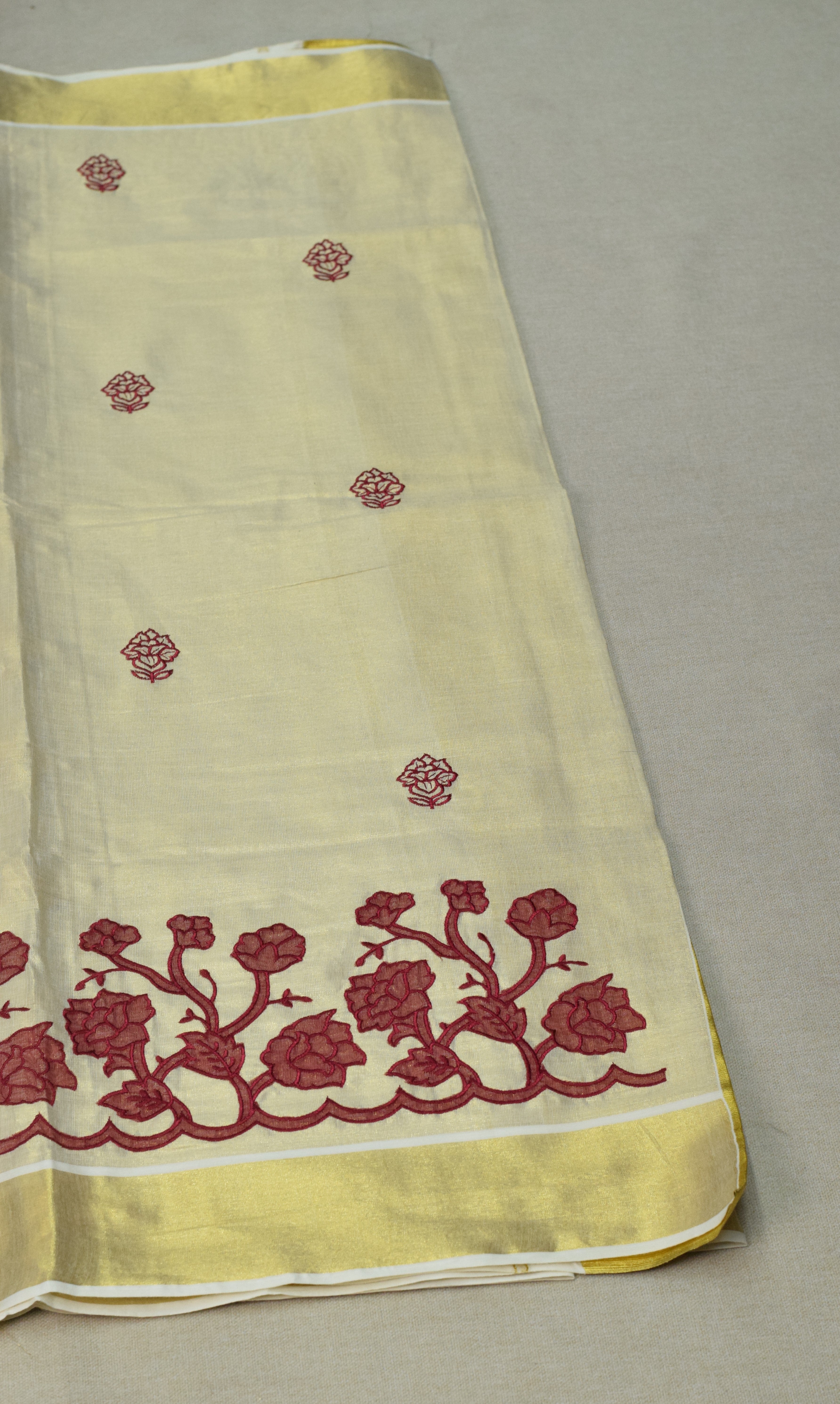 Kerala Tissue Saree with Maroon Floral Embroidery & Golden Kasavu Border