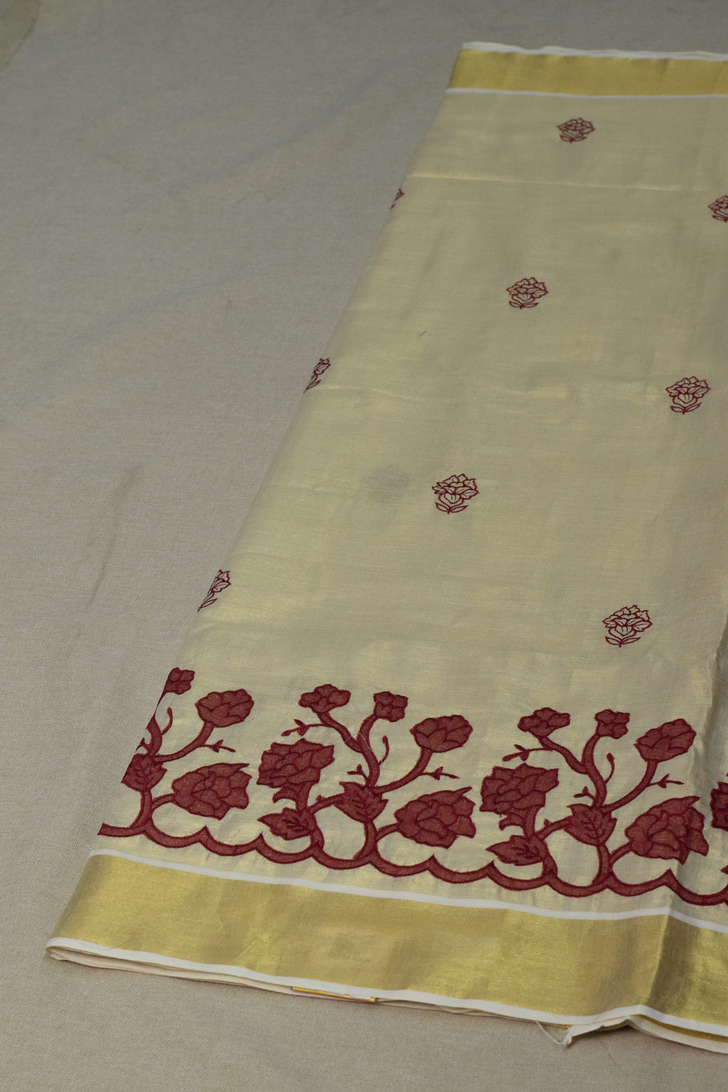 Kerala Tissue Saree with Maroon Floral Embroidery & Golden Kasavu Border