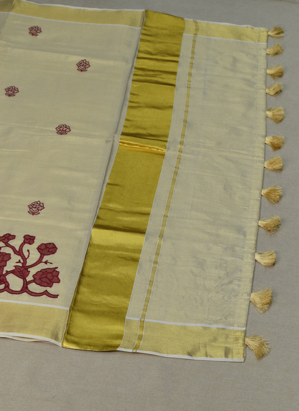 Kerala Tissue Saree with Maroon Floral Embroidery & Golden Kasavu Border