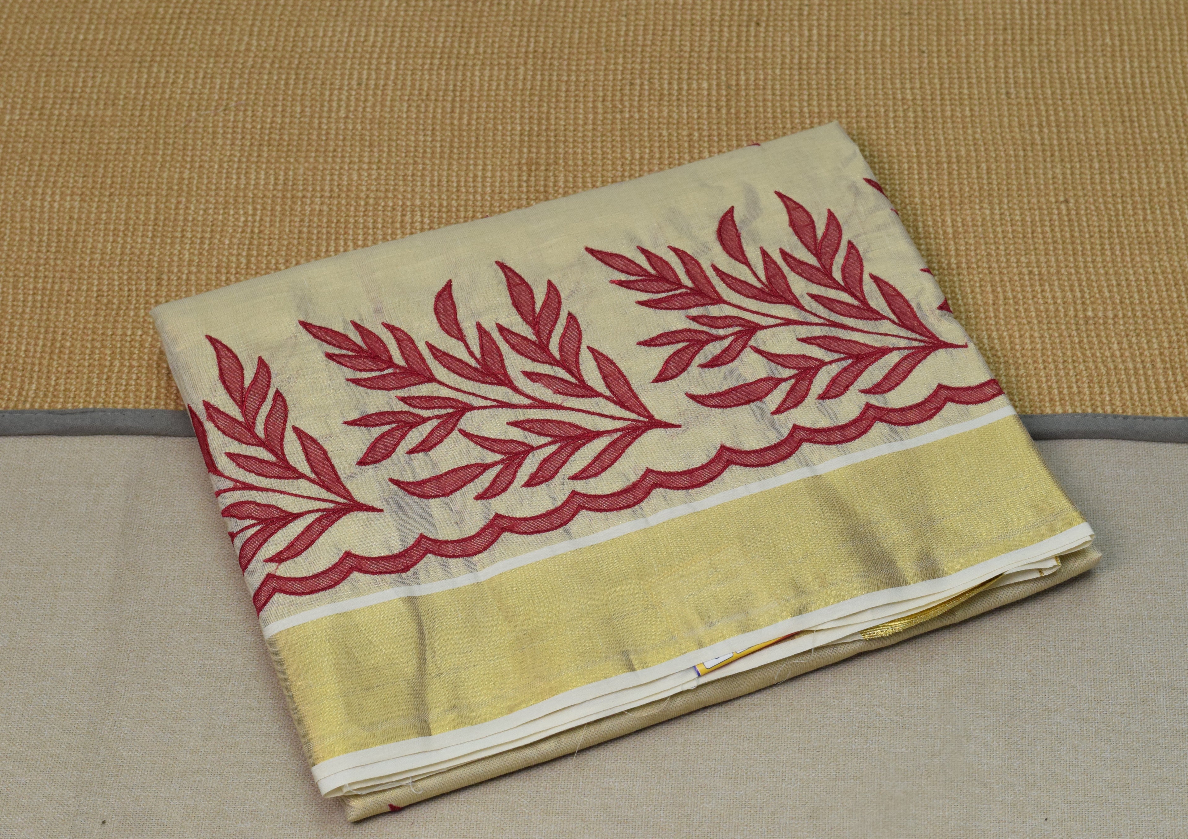Kerala Tissue Saree with Maroon Floral Embroidery & Golden Border
