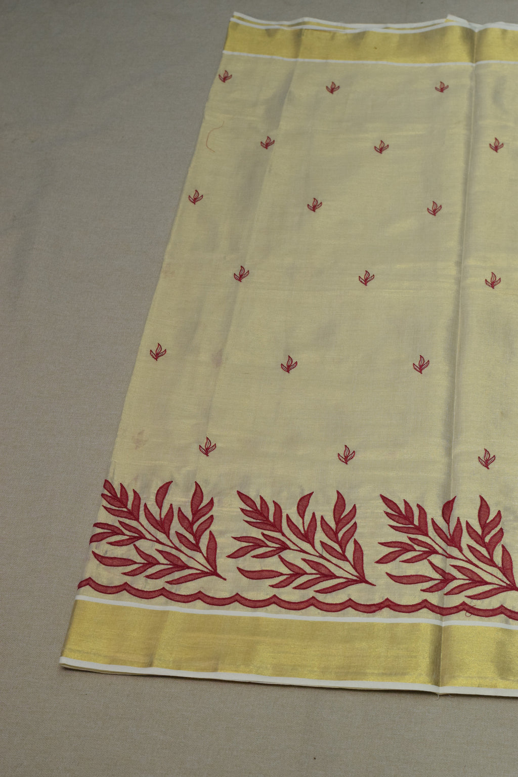 Kerala Tissue Saree with Maroon Floral Embroidery & Golden Border