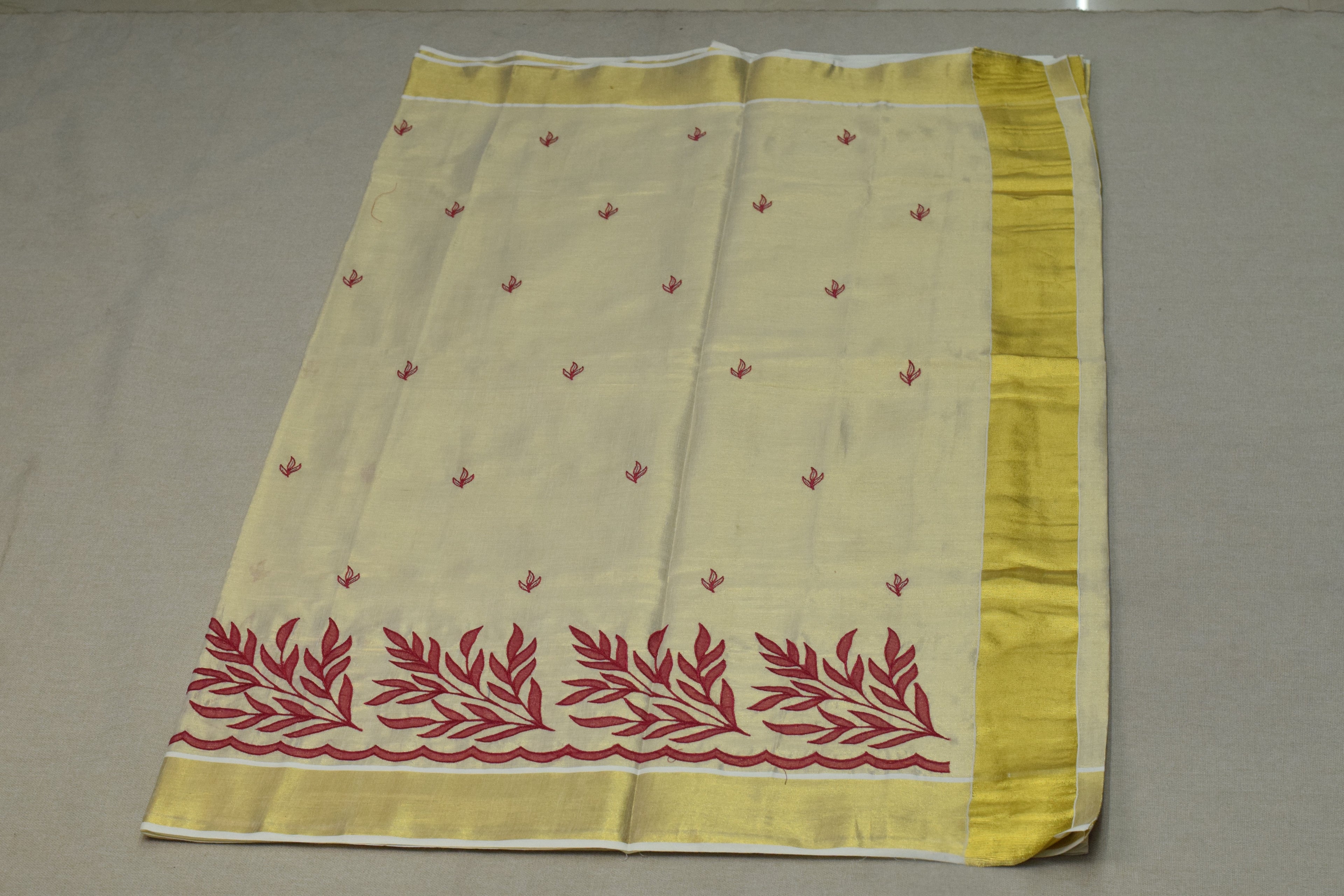 Kerala Tissue Saree with Maroon Floral Embroidery & Golden Border