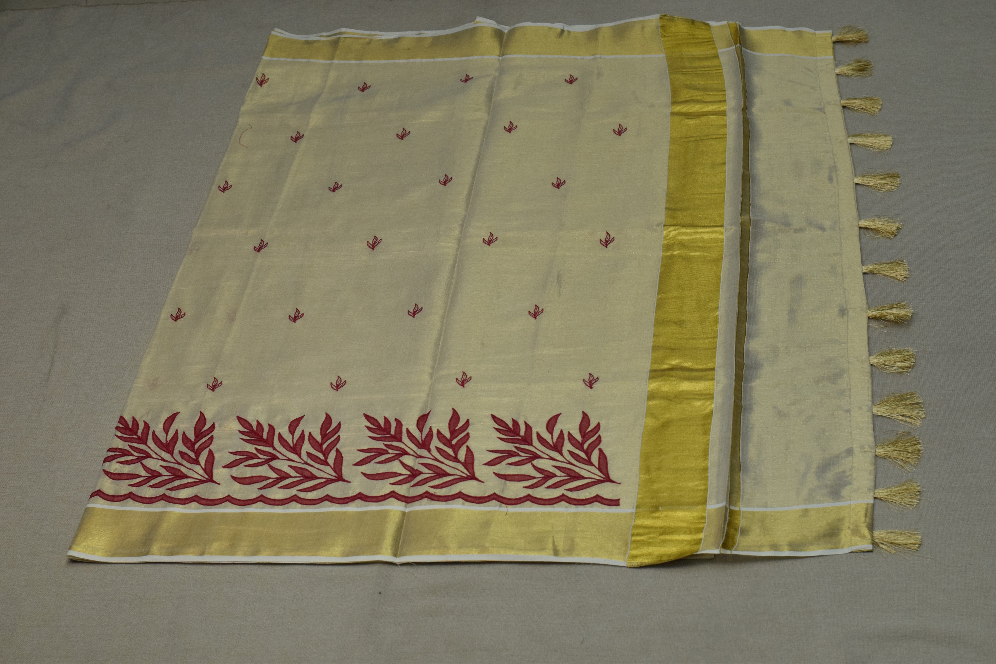 Kerala Tissue Saree with Maroon Floral Embroidery & Golden Border