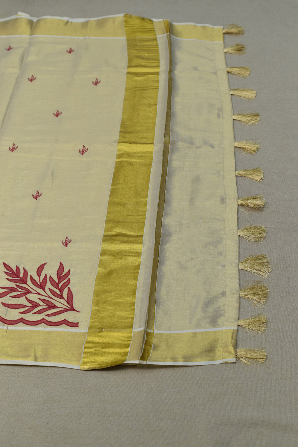 Kerala Tissue Saree with Maroon Floral Embroidery & Golden Border