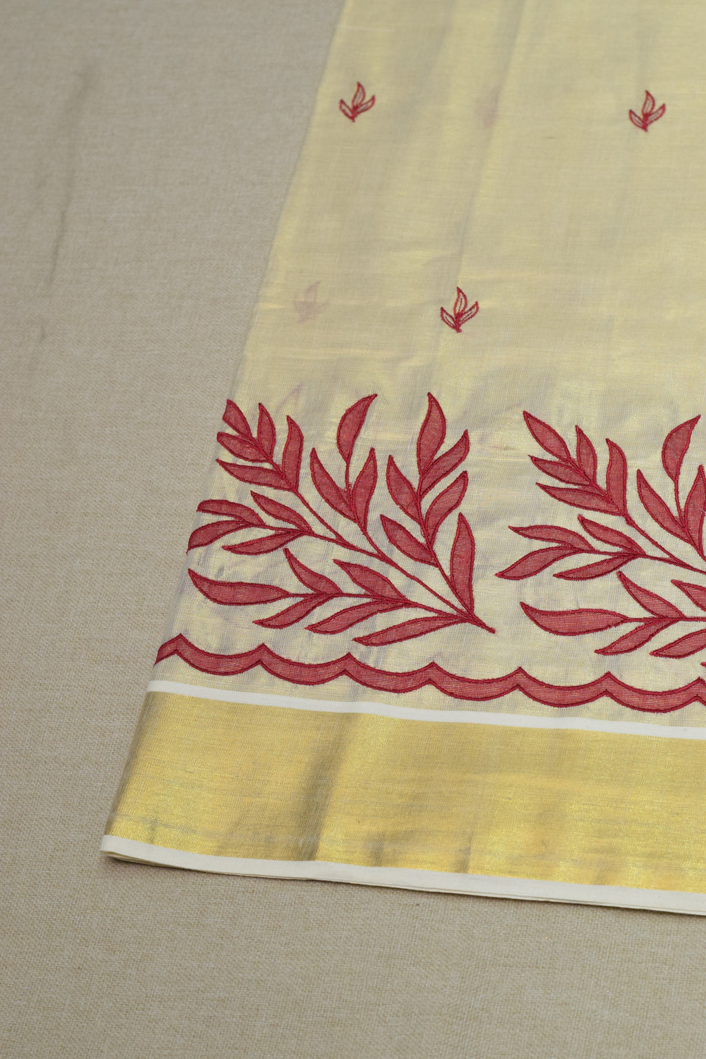 Kerala Tissue Saree with Maroon Floral Embroidery & Golden Border