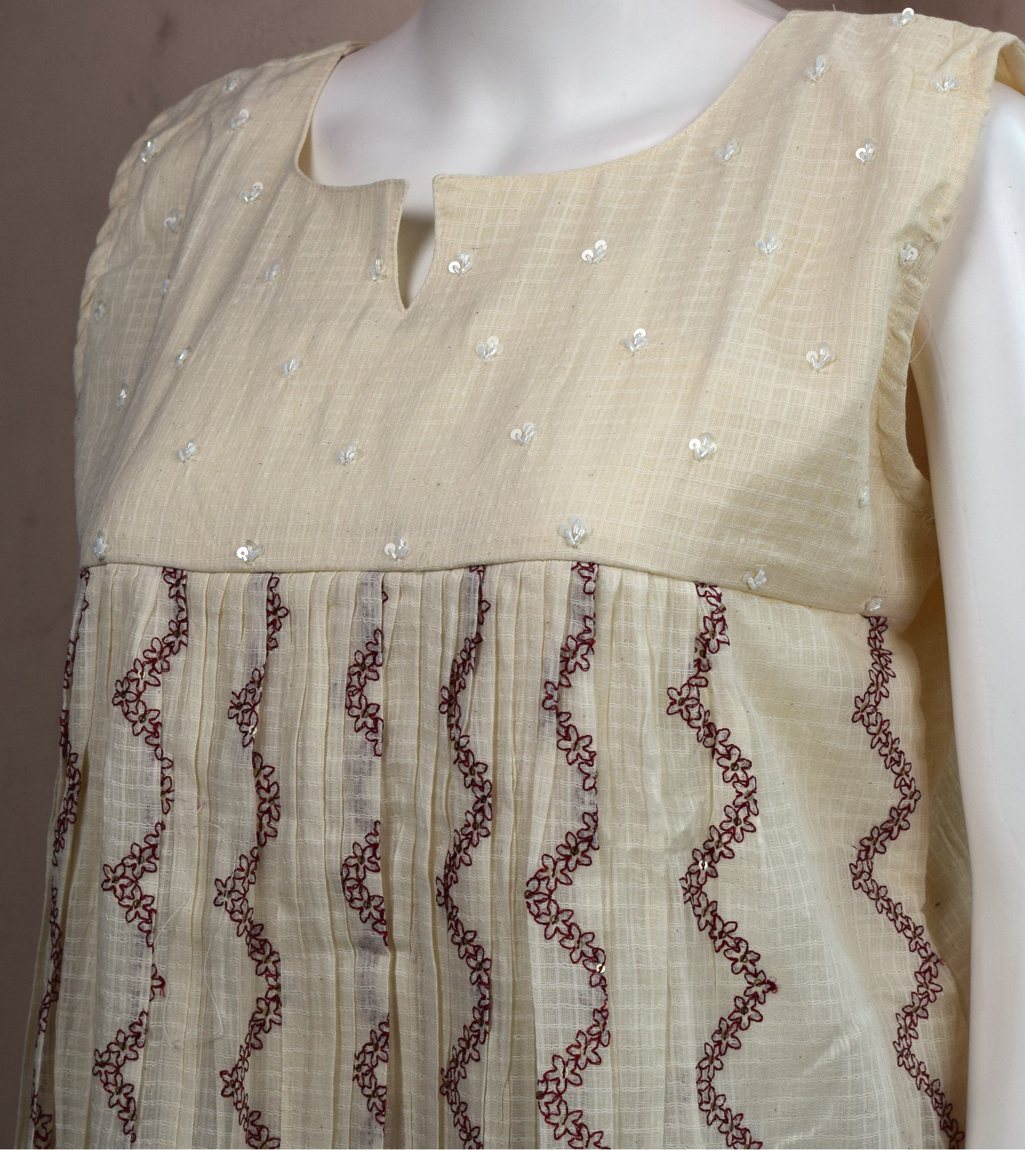 Women's Cream Embroidered Sleeveless Cotton Blend A-Line Top | Casual & Ethnic Wear