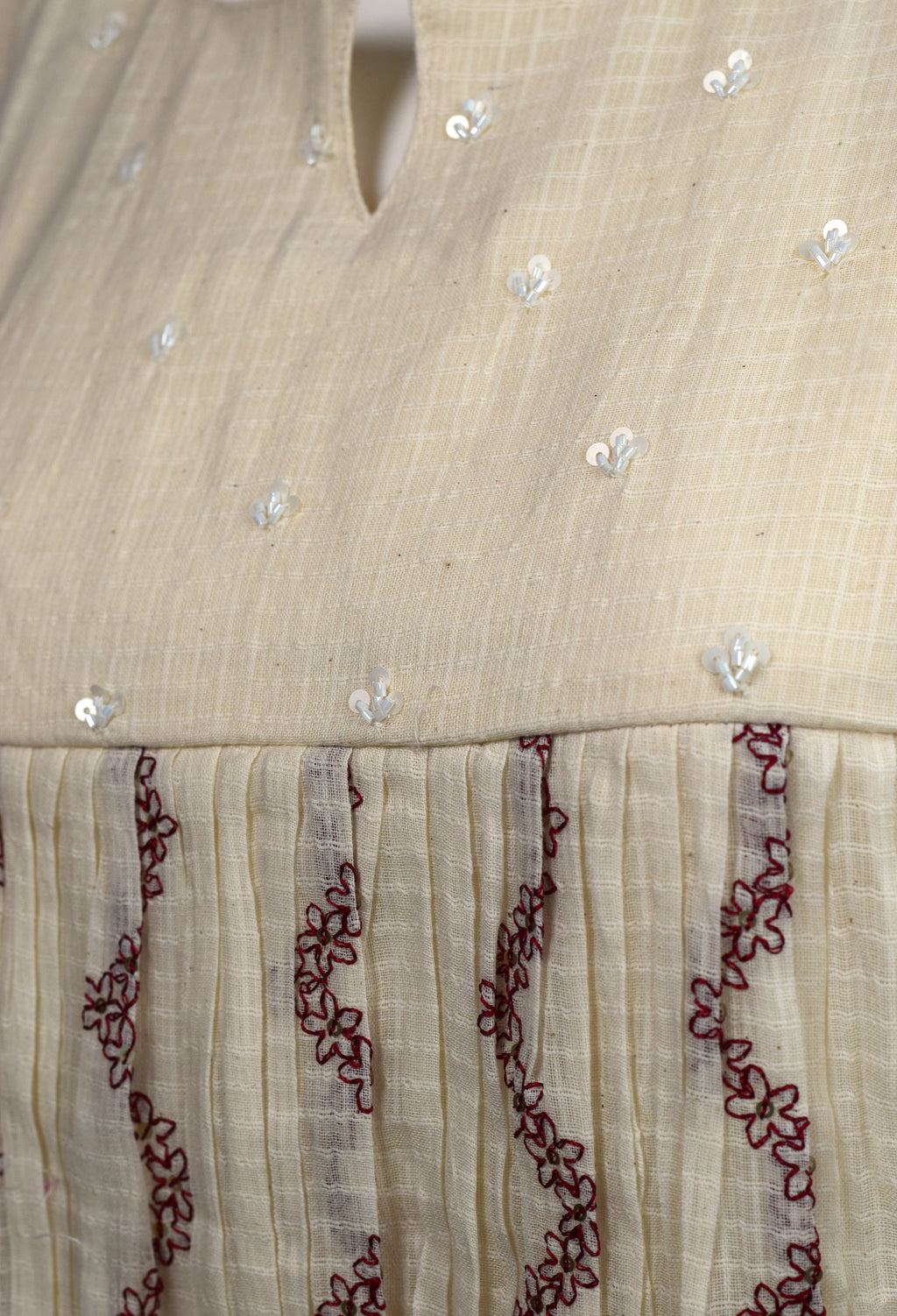 Women's Cream Embroidered Sleeveless Cotton Blend A-Line Top | Casual & Ethnic Wear